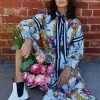 Binny - "EGG CUP POSY." Floral Print Linen/Viscose Midi Dress with Ribbon Placket & Neck Tie & Belt