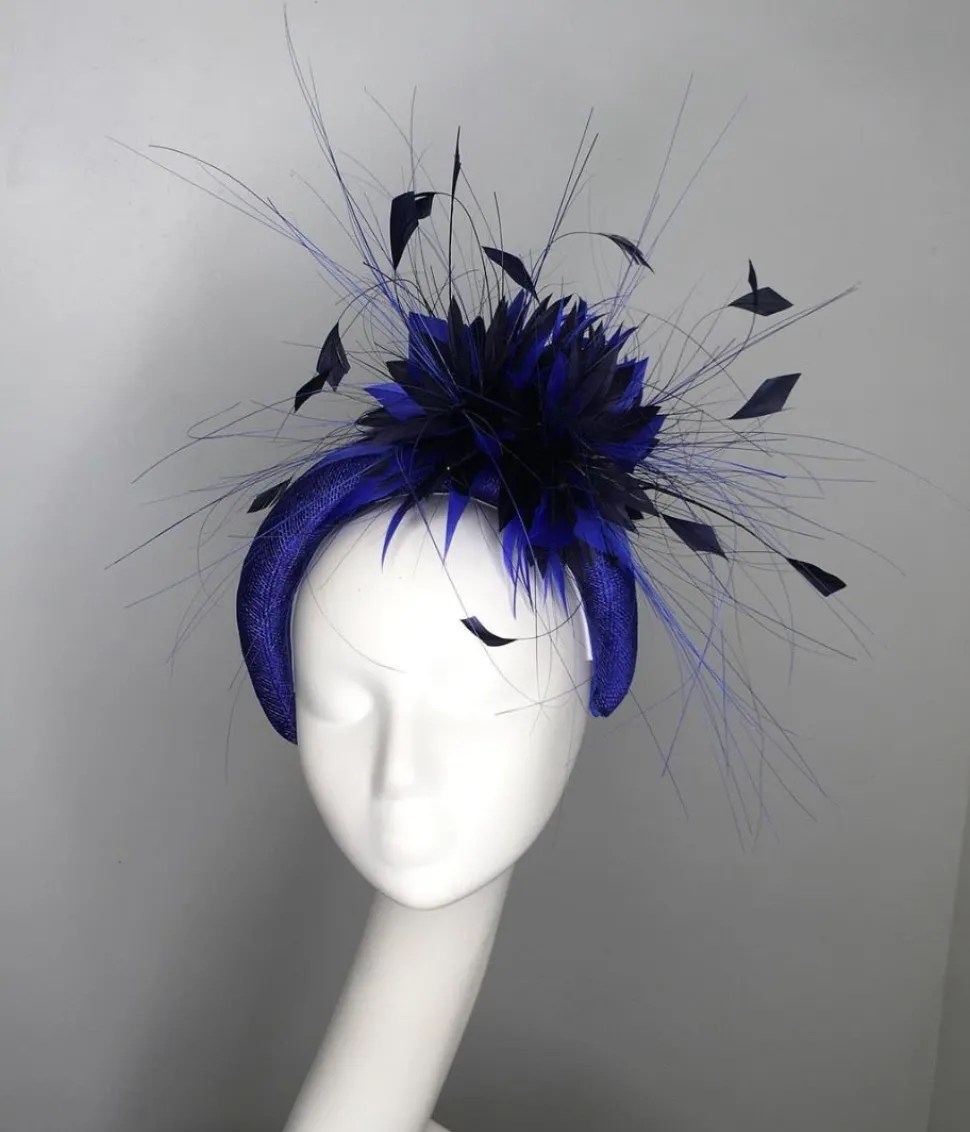 melanie_ferrero__electric_0.webp Melanie Ferrero - Electric Blue Headband with Blue Flower Black Feather