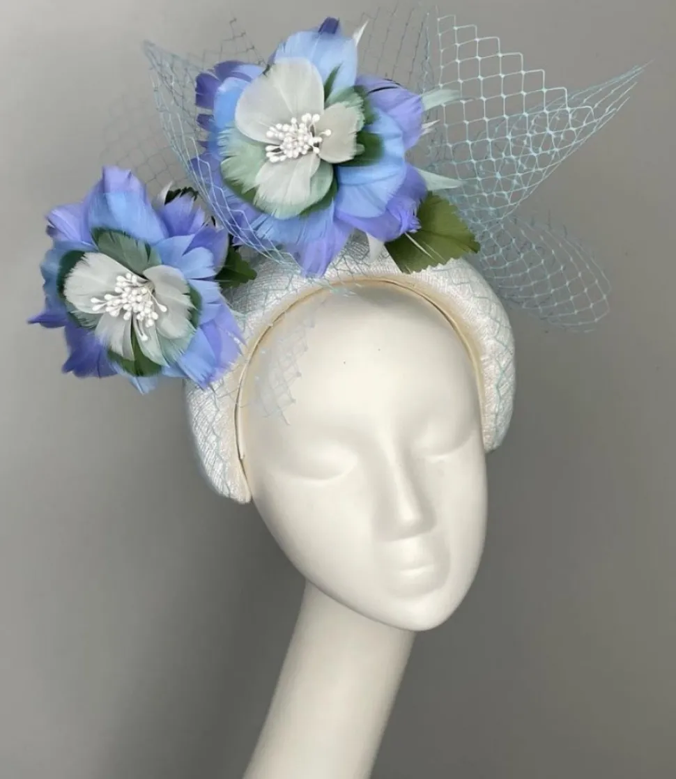 melanie_ferrero__white_he_2.webp Melanie Ferrero - White Headband with Blue Feather Flowers