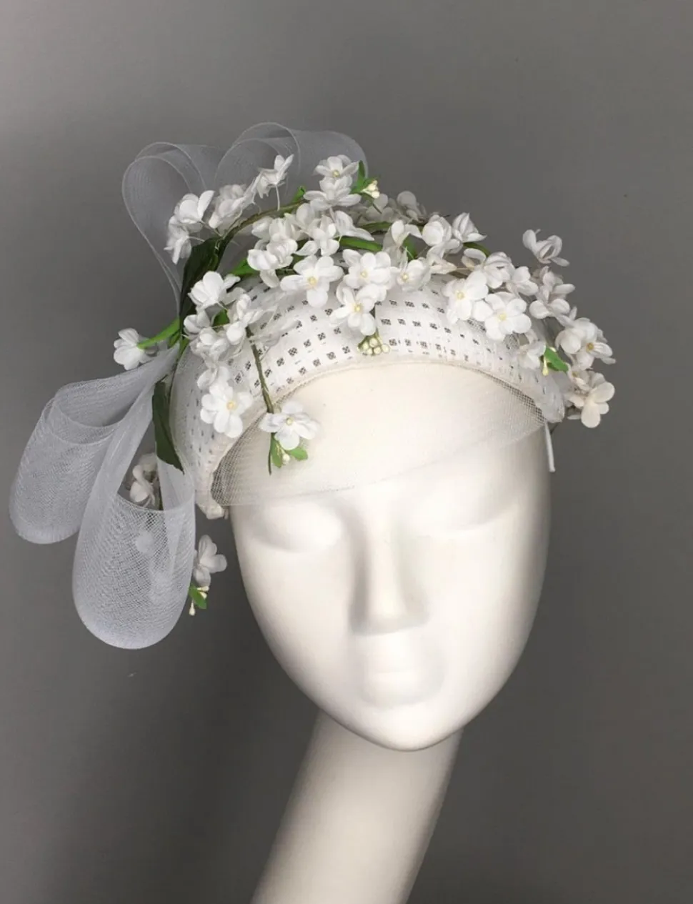 melanie_ferrero__white_we_0.webp Melanie Ferrero - White Weave Bandeau with Green Flowers